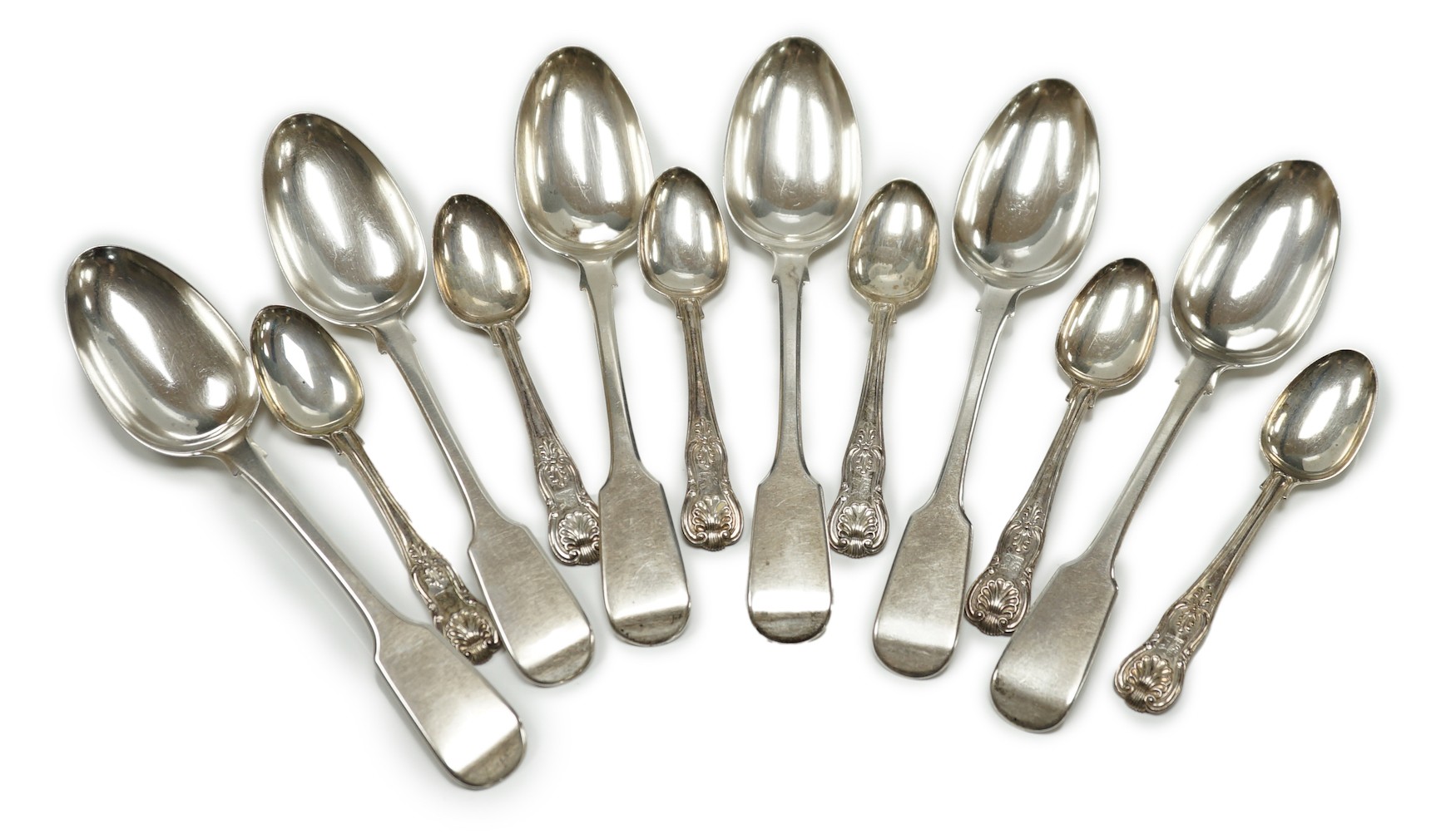 A set of six Victorian silver fiddle pattern table spoons, Samuel Hayne, London, 1863 and a set of late William IV silver King's pattern teaspoons, William Eaton, London, 1836, 21oz.